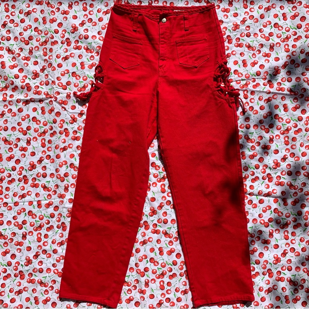 Really rad vintage 80s 90s high end tomato red jeans w/ hip peep detail by Navi